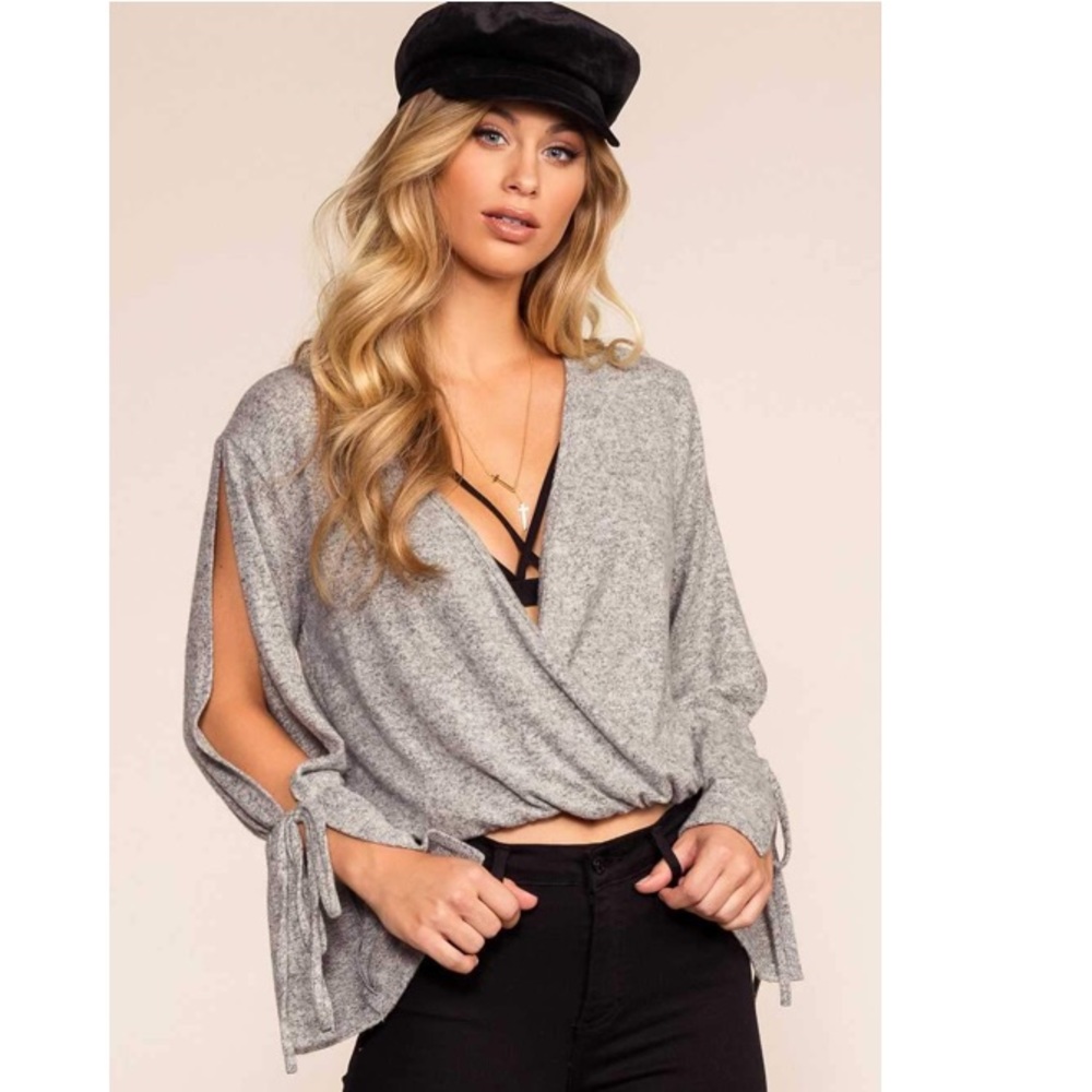 Marled grey sweater with sleeve cutout